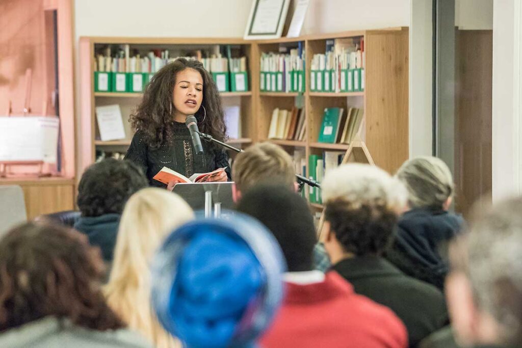 A writer reading to an audience